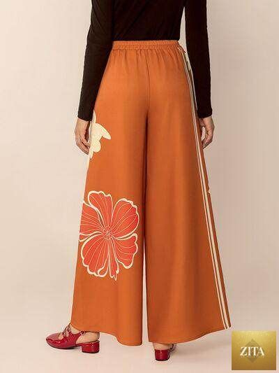 Printed elastic waist wide-leg pants by Selvanelle featuring comfortable fit and stylish design.