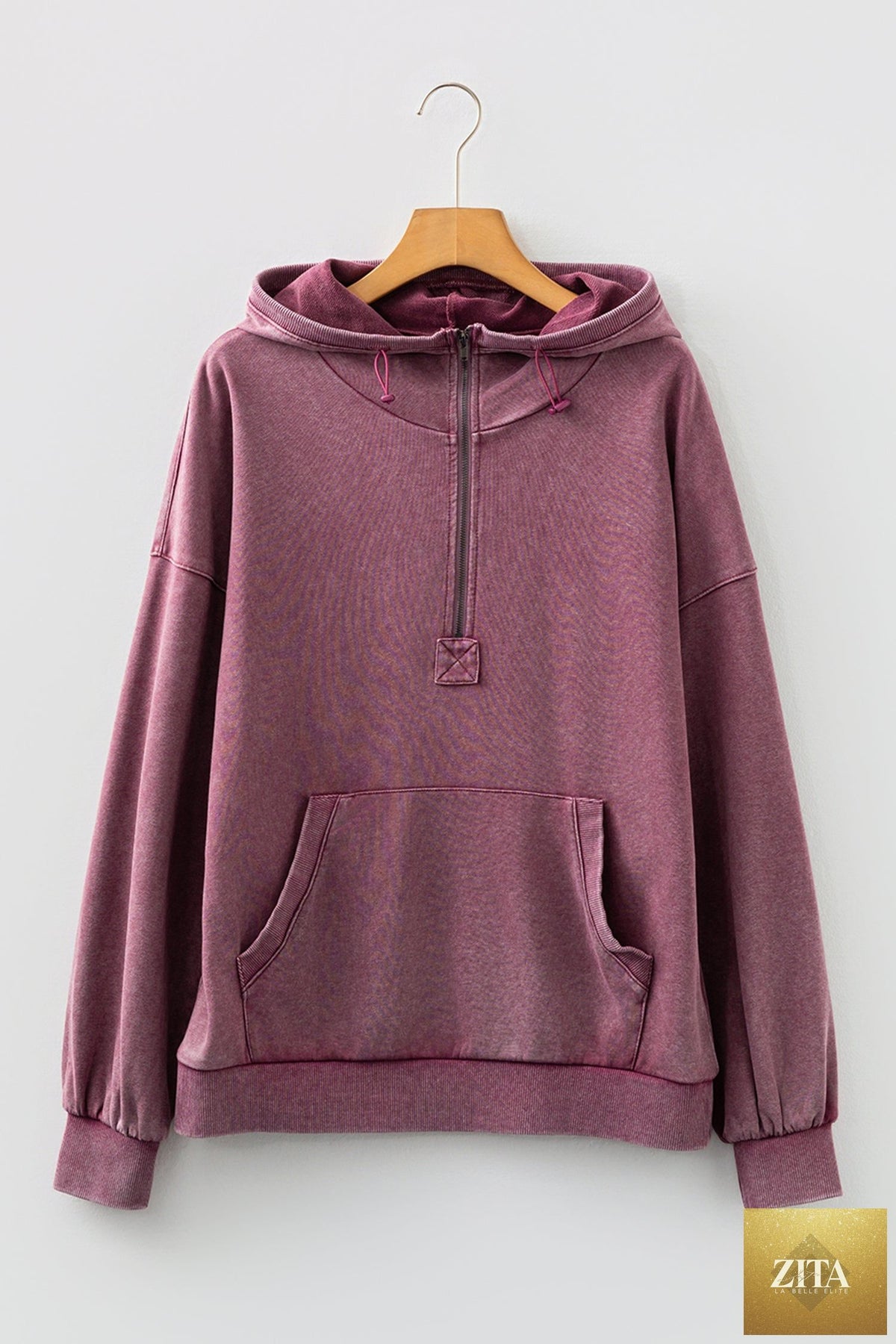 Black half zip hoodie with kangaroo pocket and mineral wash, featuring a relaxed baggy fit from Wild and Free Boutique.