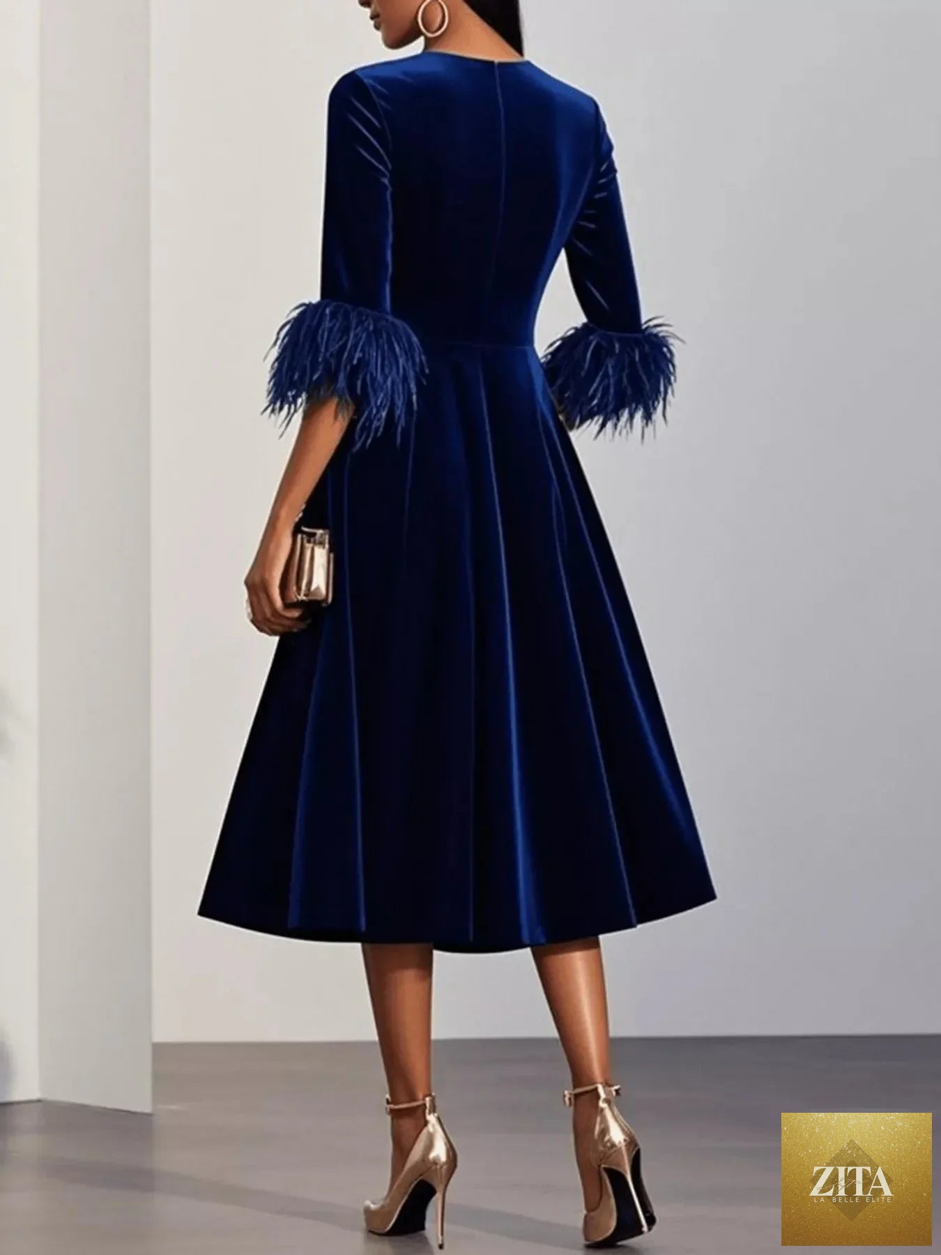 Velvet midi dress from Shopiebay featuring feather cuffs, elegant design, and a fitted silhouette for a sophisticated look.