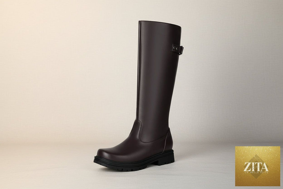 Women’s retro British-style riding boots by Zita La Belle Elite, knee-high leather boots with buckle detail and classic design.