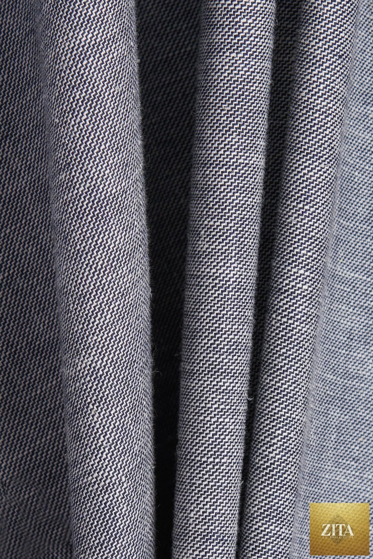 Light gray bespoke suit by Bright Moons, tailored fit with classic lapel and matching trousers, displayed on a hanger.