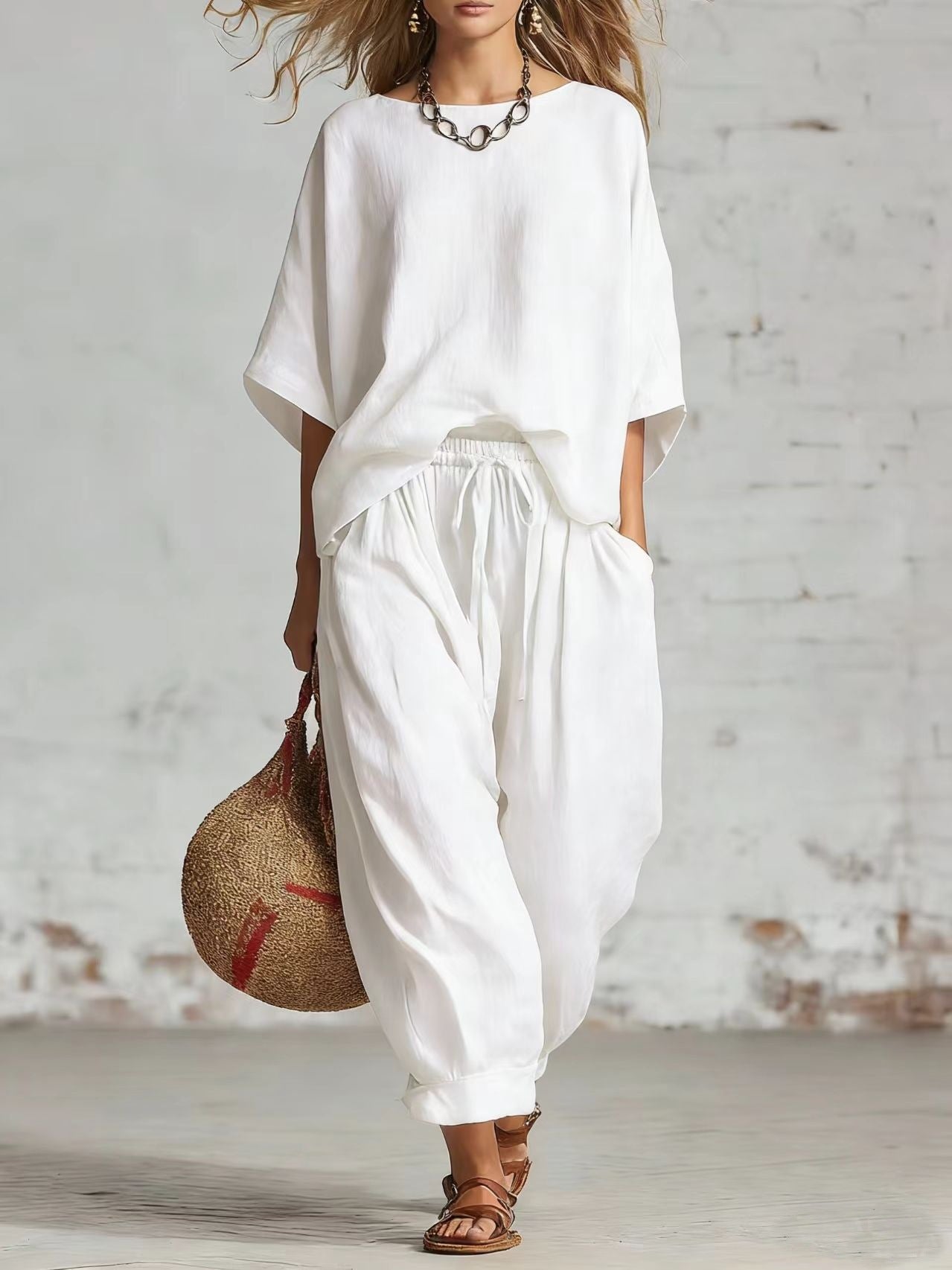 Women’s solid color casual set by FitiqueFit featuring a loose t-shirt and ankle pants, perfect for relaxed everyday wear.