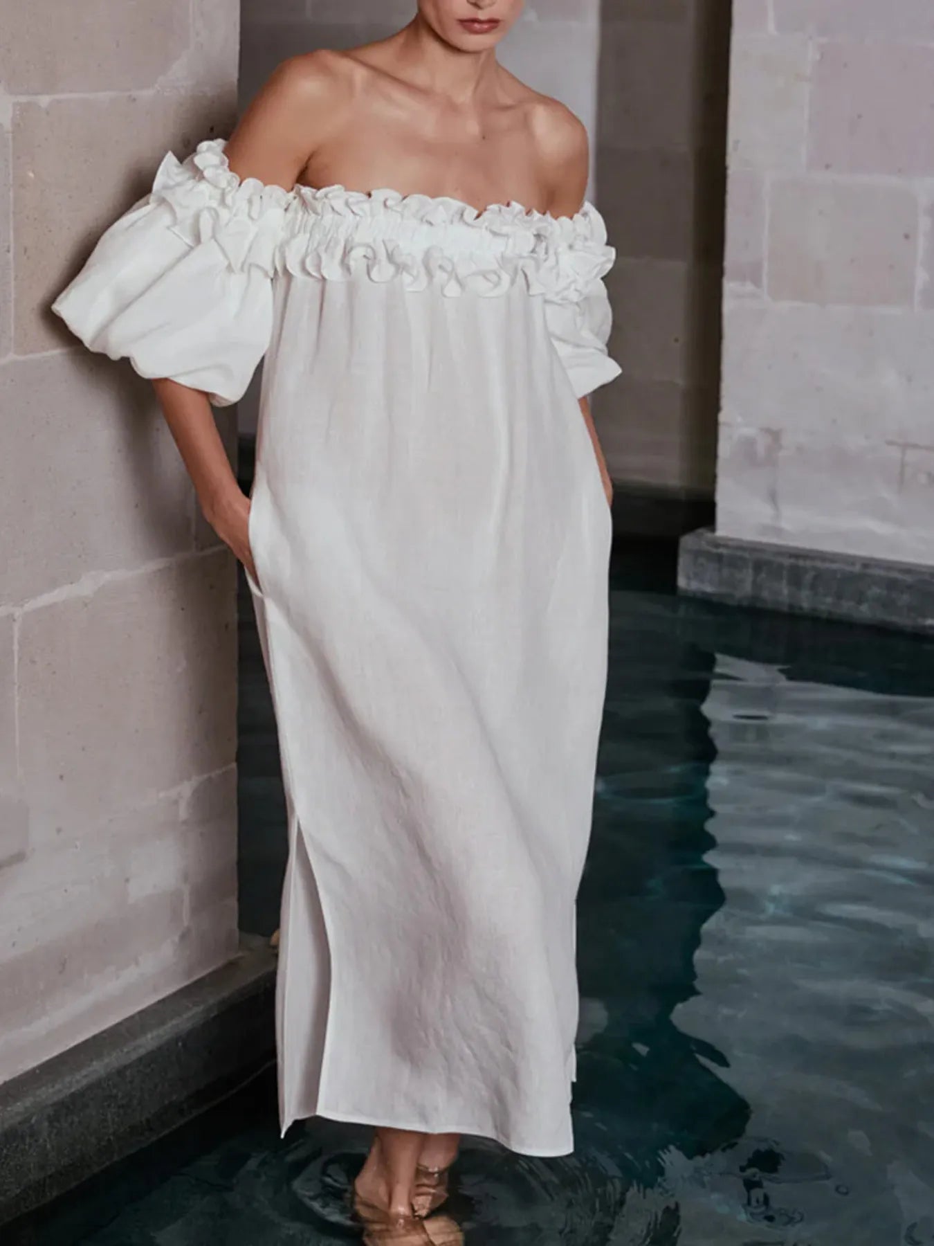 Off-shoulder dress with side slit from Shopiebay, featuring a stylish silhouette and flowing fabric perfect for elegant occasions.