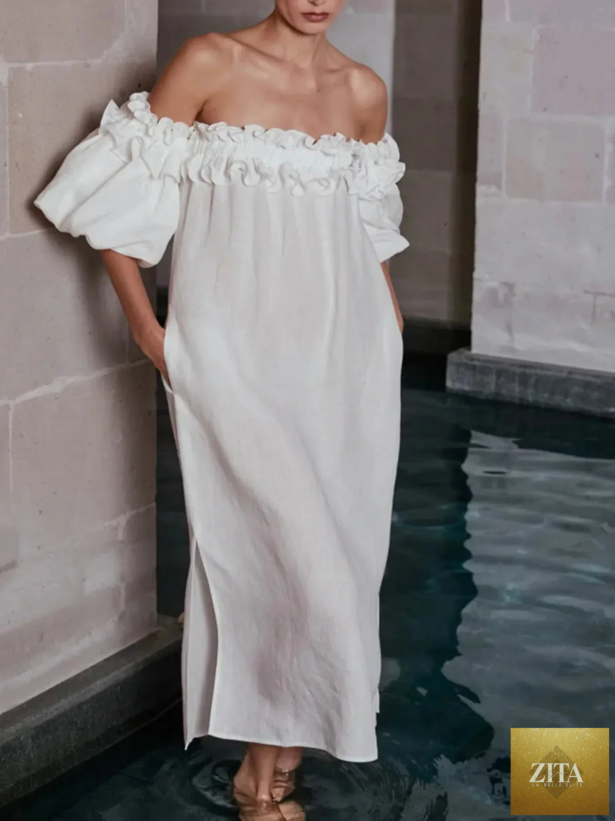Off-shoulder dress with side slit from Shopiebay, featuring a stylish silhouette and flowing fabric perfect for elegant occasions.