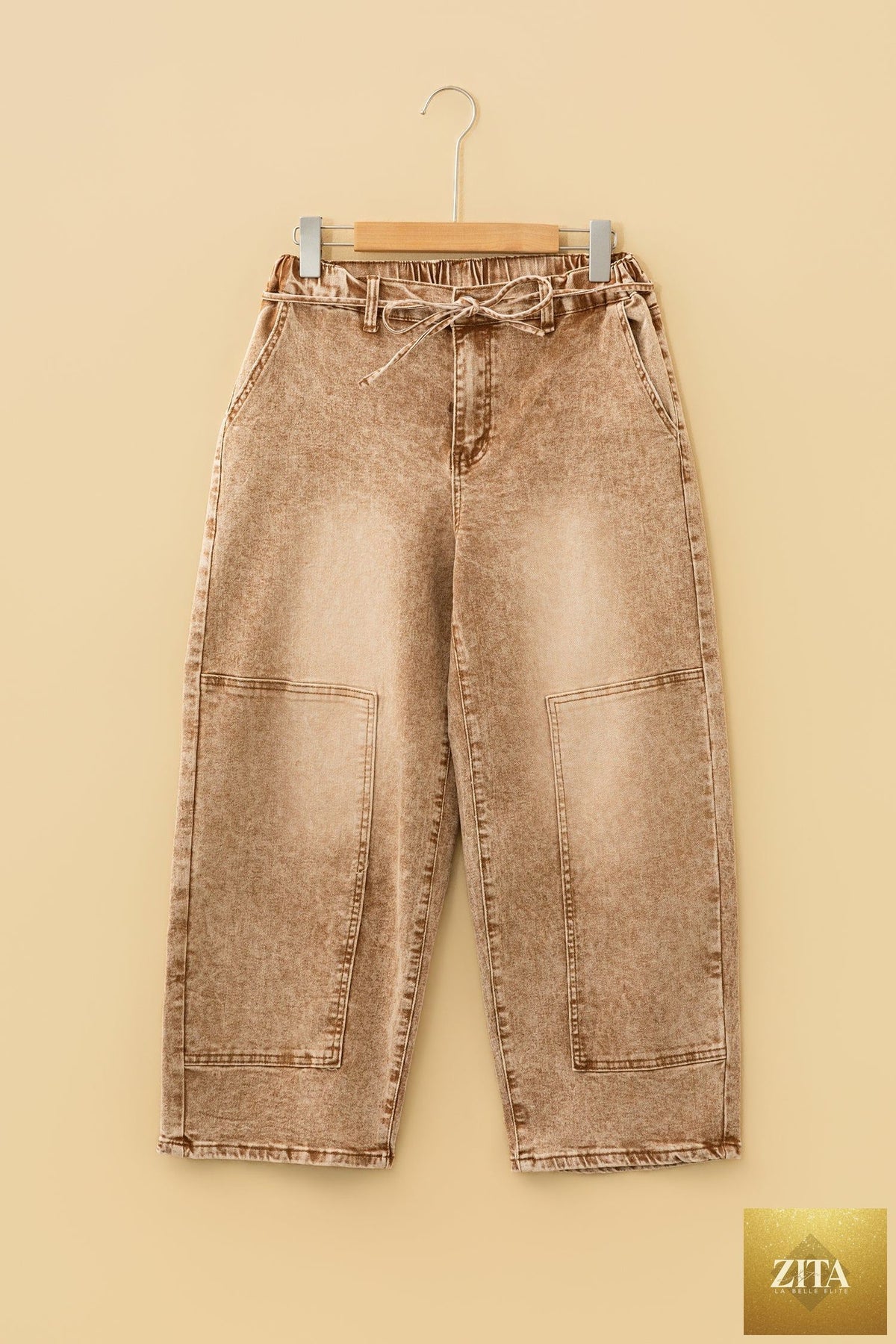 Smoke gray acid wash barrel fit denim jeans with waist string by Wild and Free Boutique, shown on a model.