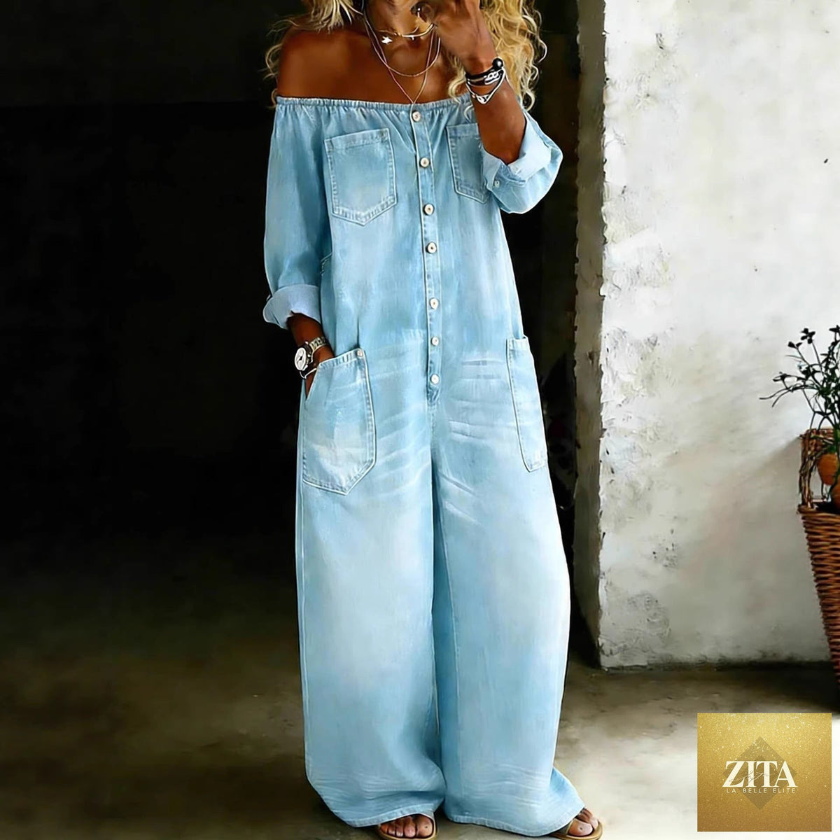 Women’s off-shoulder washed faux denim strap overalls jumpsuit by Zita La Belle Elite, casual wear with ruffled neckline and adjustable straps.