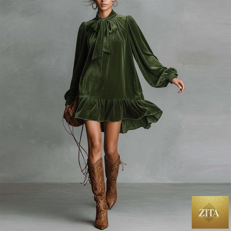 Women’s bow-tie puff sleeve dress by FitiqueFit featuring an asymmetric ruffle hem and short, casualwear style.