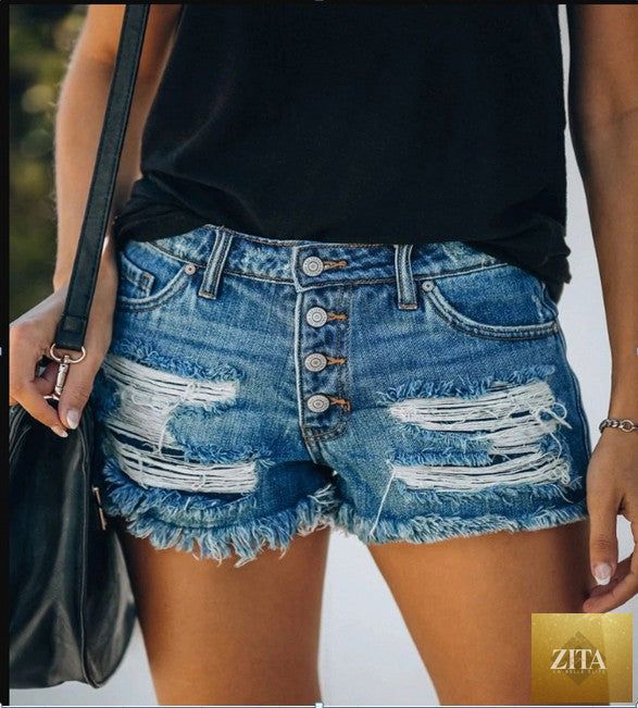 Women’s ripped tassel denim shorts with frayed hems and distressed details, perfect for summer casual wear.