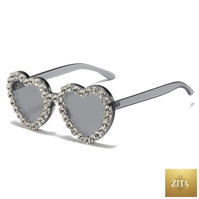 Peach heart-shaped rhinestone sunglasses with Y2K style, trendy eyewear by FitiqueFit featuring sparkling rhinestone details.