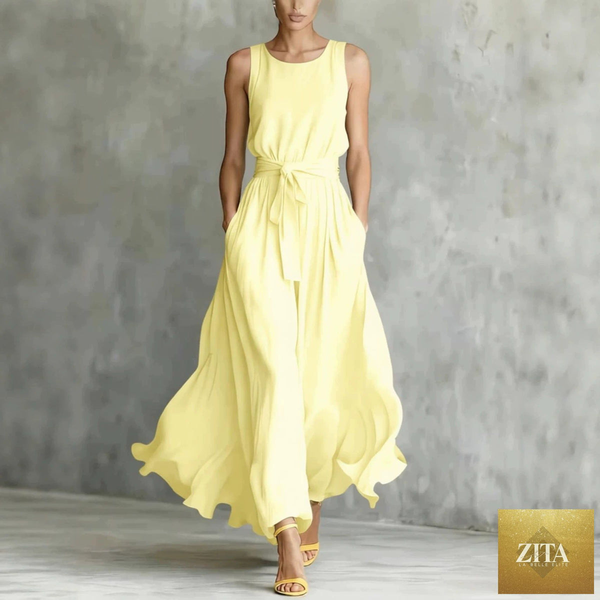 Women's sleeveless maxi dress with lace-up waist and cinching detail by Zita La Belle Elite, showcasing the flowing fabric and elegant design.