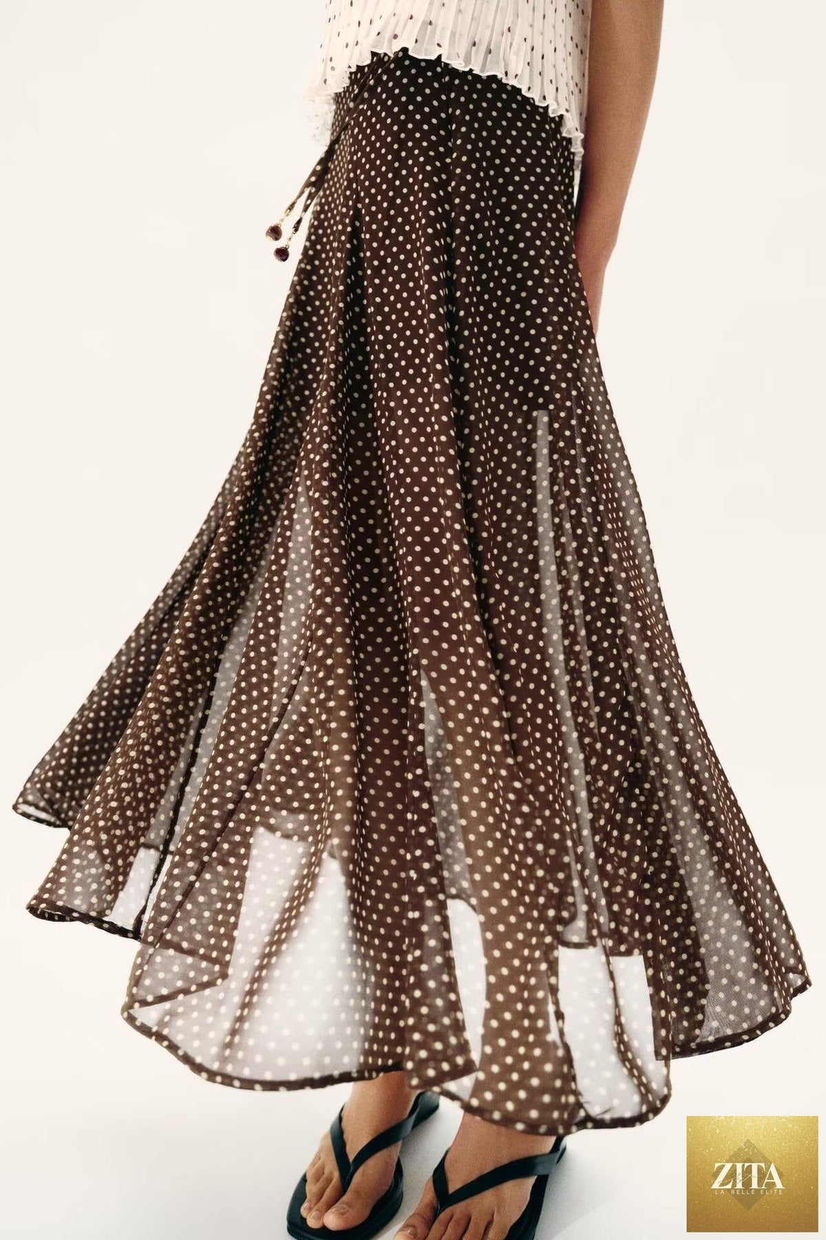 Elegant polka dot midi skirt for women, perfect for spring fashion, from Wanita Store, featuring a stylish and comfortable design.