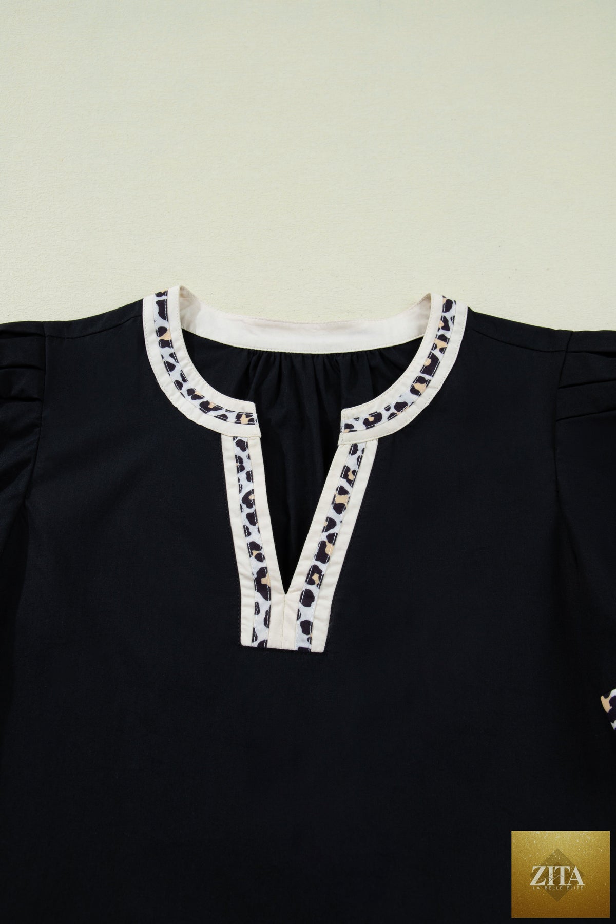 Black leopard trim notched neck short puff sleeve mini dress from Wild and Free Boutique, featuring a stylish shift silhouette.