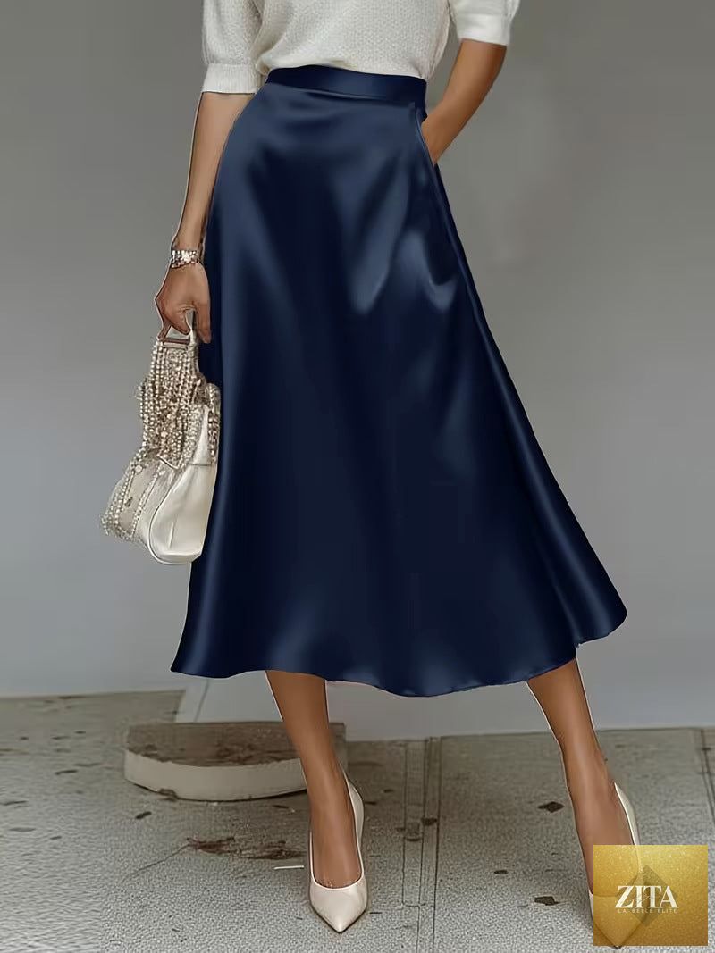Women's satin solid color mid-length skirt by Zita La Belle Elite, featuring slight stretch and smooth fabric.