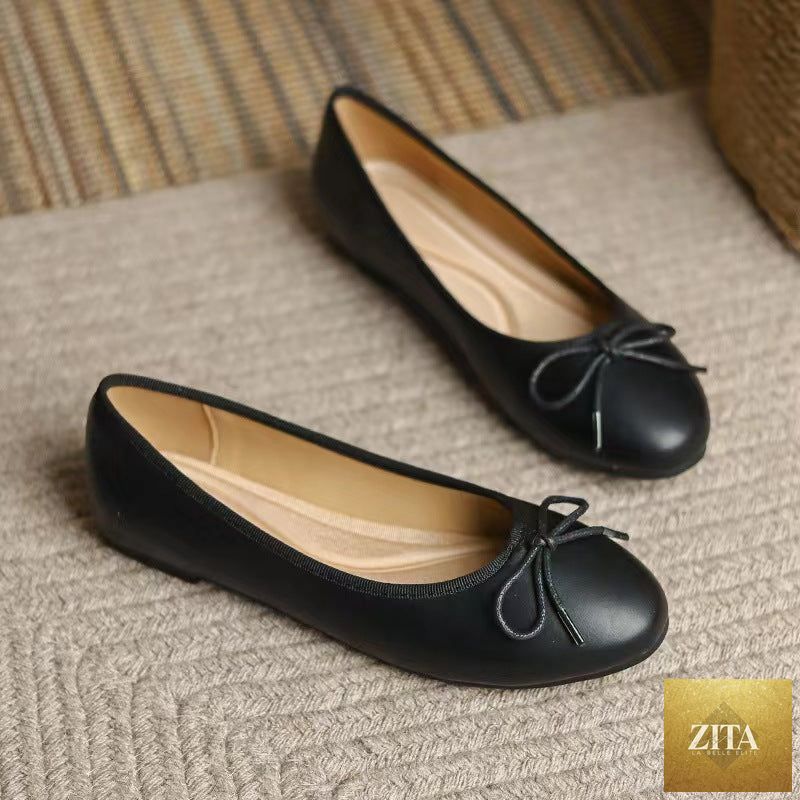 Women's slip-on flats with egg-roll edge and round toe, inspired by Chanel, by FitiqueFit, showcasing stylish footwear design.