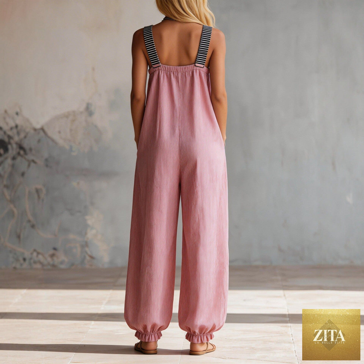 Women's long-sleeve waist-cinching flared pants set by Zita La Belle Elite, casualwear with fitted top and flowy pant legs.