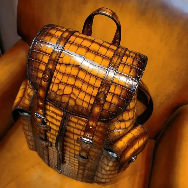 Unisex crocodile leather backpack from DON JOHN with textured crocodile pattern and sturdy straps, stylish and functional.