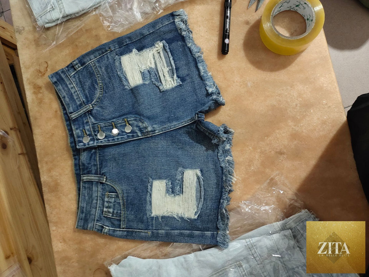 Women’s ripped tassel denim shorts with distressed details and frayed hem, perfect for summer casual wear.