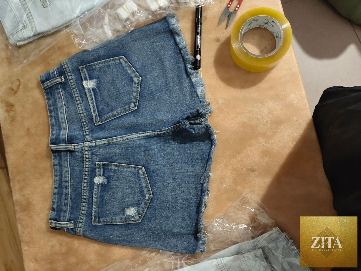 Women’s ripped tassel denim shorts featuring frayed hems and distressed details, casual summer fashion from Wanita Store.