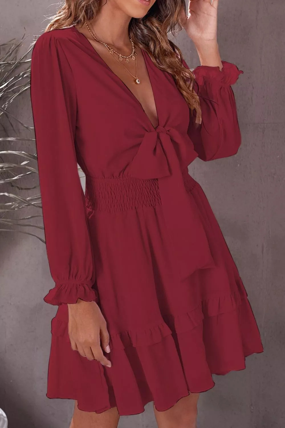 Elegant tie-front ruffle mini dress with smocked waist by Shopiebay, featuring a stylish, feminine design and flattering fit.