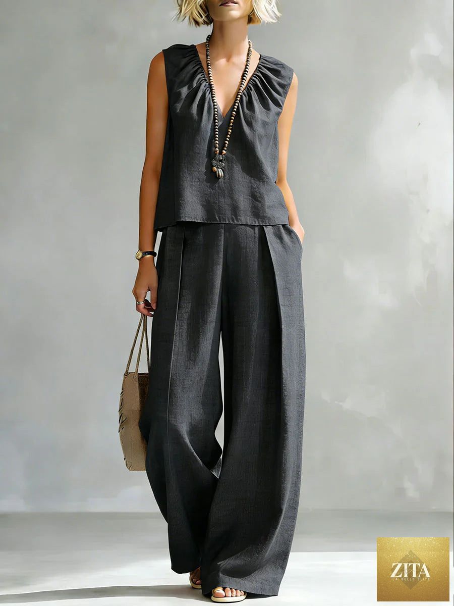 Women's sleeveless cotton-linen shirt and pants set by FitiqueFit, casual urban 2-piece outfit shown in light fabric with relaxed fit.