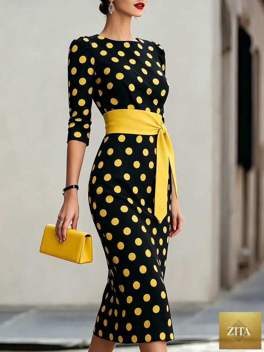 Women's retro polka-dot bodycon midi dress with belt and cross-tie detail, casualwear by Zita La Belle Elite.
