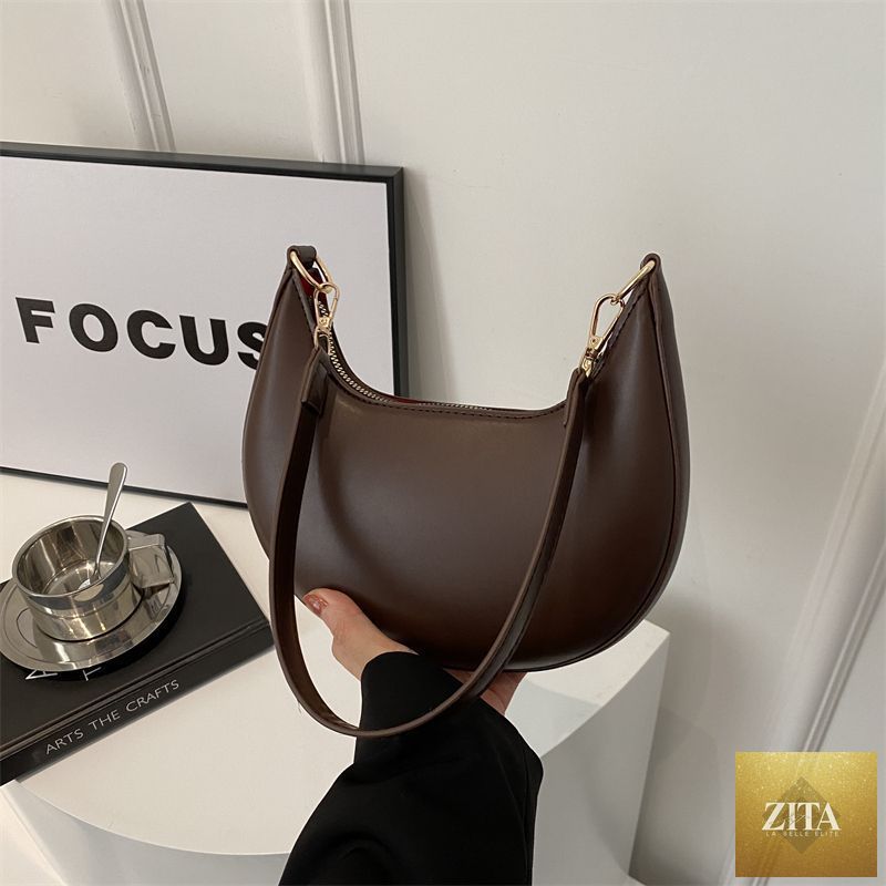 Textured shoulder bag for women by Social Buzz eSIMs, featuring a simple, versatile design with a modern all-match style.