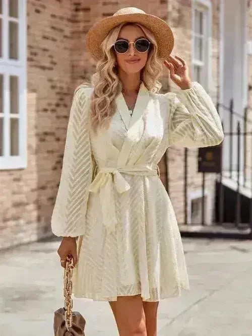 Women’s long sleeve wrap dress by Femstylo with flattering front tie design, showing the elegant neckline and fitted waist.
