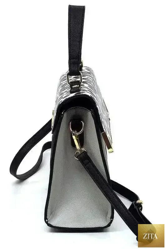 Vegan leather satchel bag by Femstylo with top handle and crossbody strap, featuring sleek design and spacious interior.