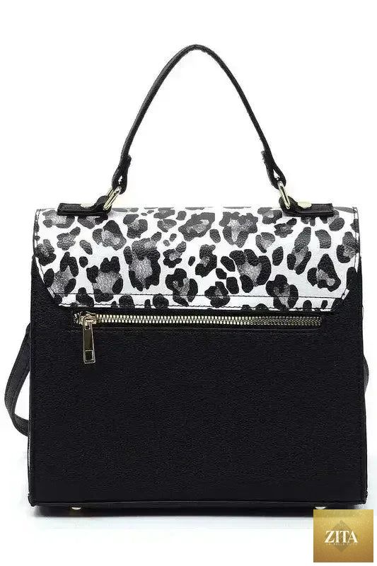 Femstylo vegan leather satchel with top handle and crossbody strap, showcasing its sleek design and sturdy construction.