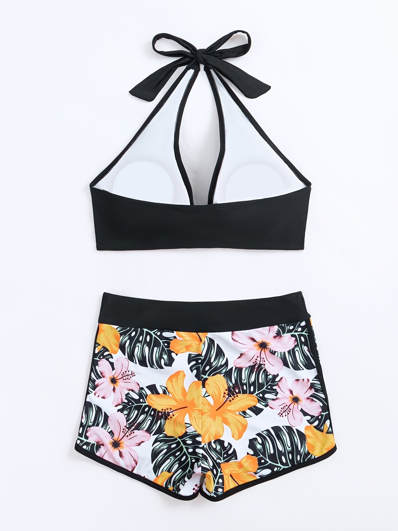 Stevvex floral halter neck bikini set with backless design, tie-neck bow, and high waist bottoms, perfect for summer beach and pool.