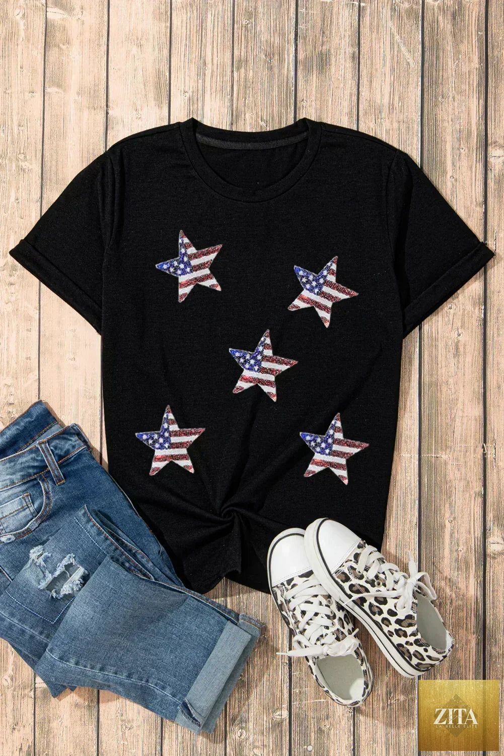 Black sequined American flag star graphic T-shirt by Femstylo, featuring bold star and flag design with shiny sequins.