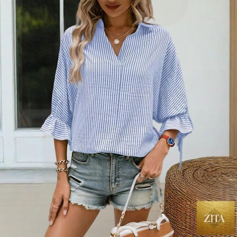 Women’s striped V-neck blouse by Zita La Belle Elite with ruffled cuffs and a tie-back slit, perfect for casual wear.
