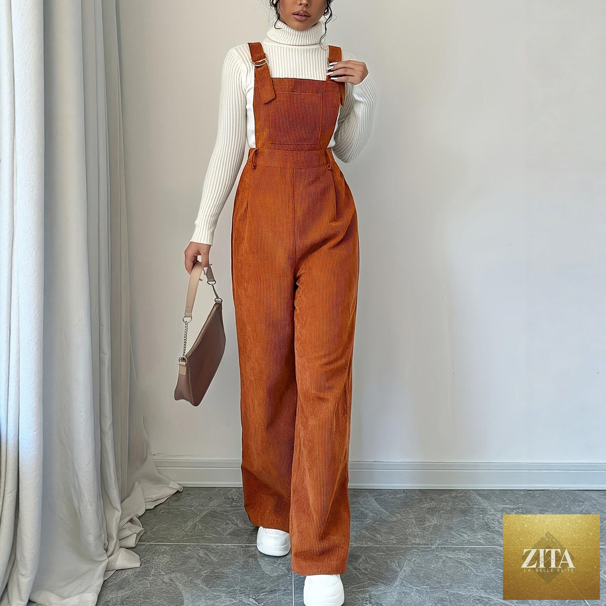 Women’s corduroy loose straight bib pants in a neutral color, featuring adjustable straps and a relaxed fit.