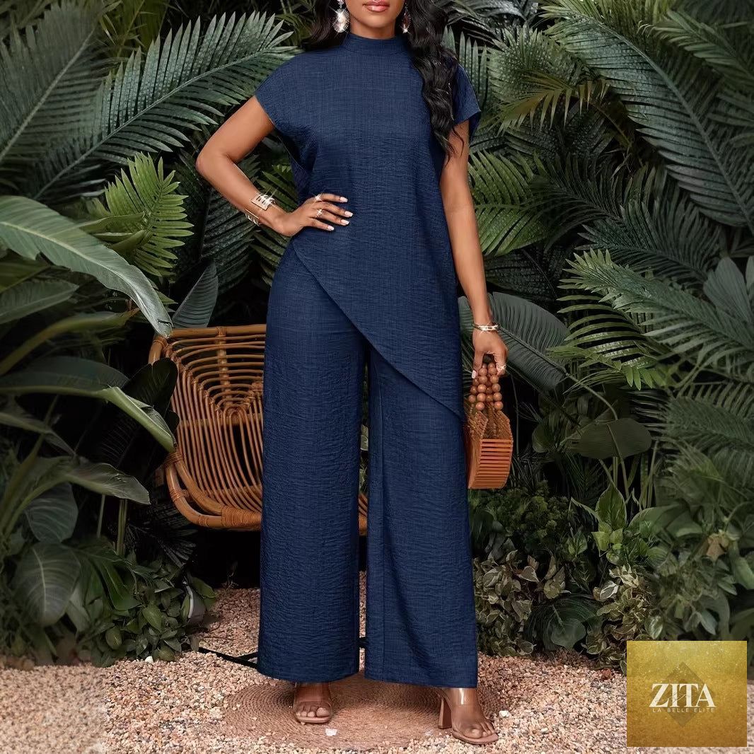 Asymmetrical sleeveless top and matching pants set for women by FitiqueFit, stylish two-piece outfit with modern design.