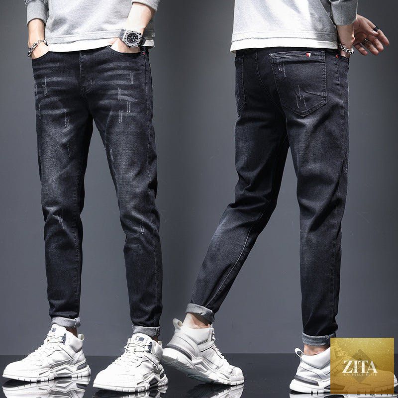 Mandotos men's ripped denim jeans showing cat-whisker scratches, distressed style, and classic five-pocket design.