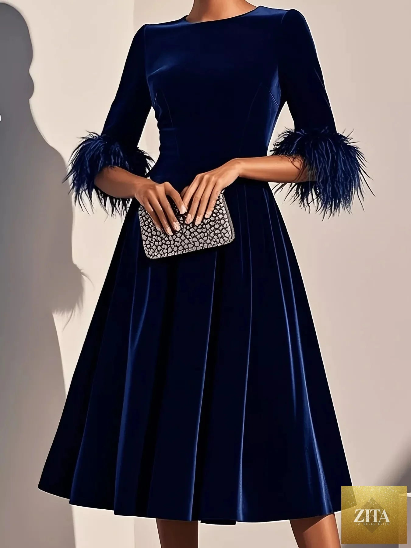 Velvet midi dress with feather cuffs, stylish and elegant, from Shopiebay, shown in deep blue with a fitted silhouette.