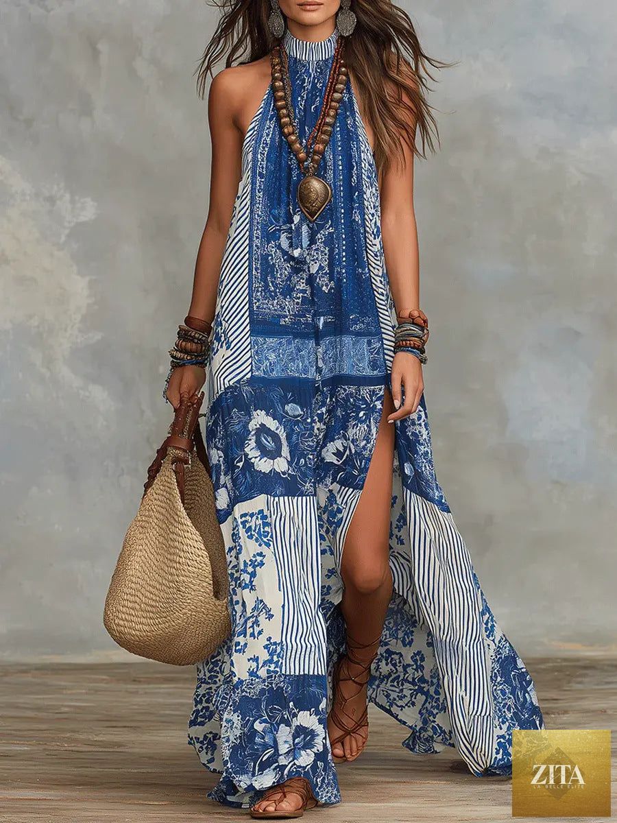 Women's printed halterneck split maxi dress by Zita La Belle Elite, sleeveless and loose fit with a vibrant floral pattern.
