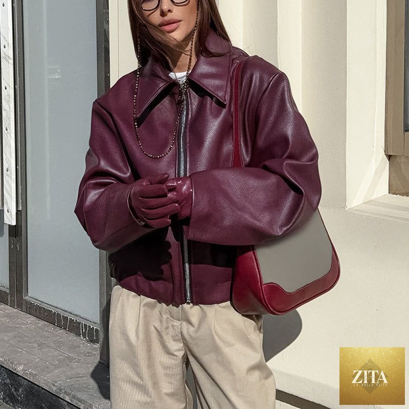 Vintage style women's solid color faux leather jacket by FitiqueFit, featuring classic design and sleek fit.