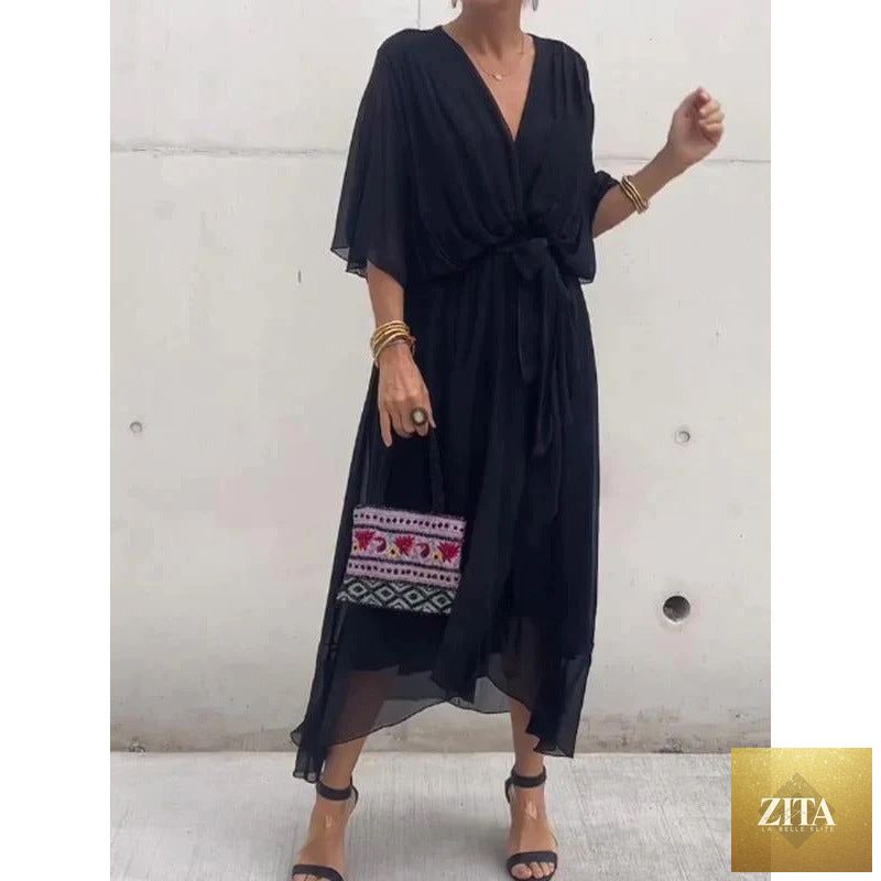 Batwing sleeve V-neck midi dress with tied irregular hem by FitiqueFit, flowing fabric and stylish design for elegant wear.