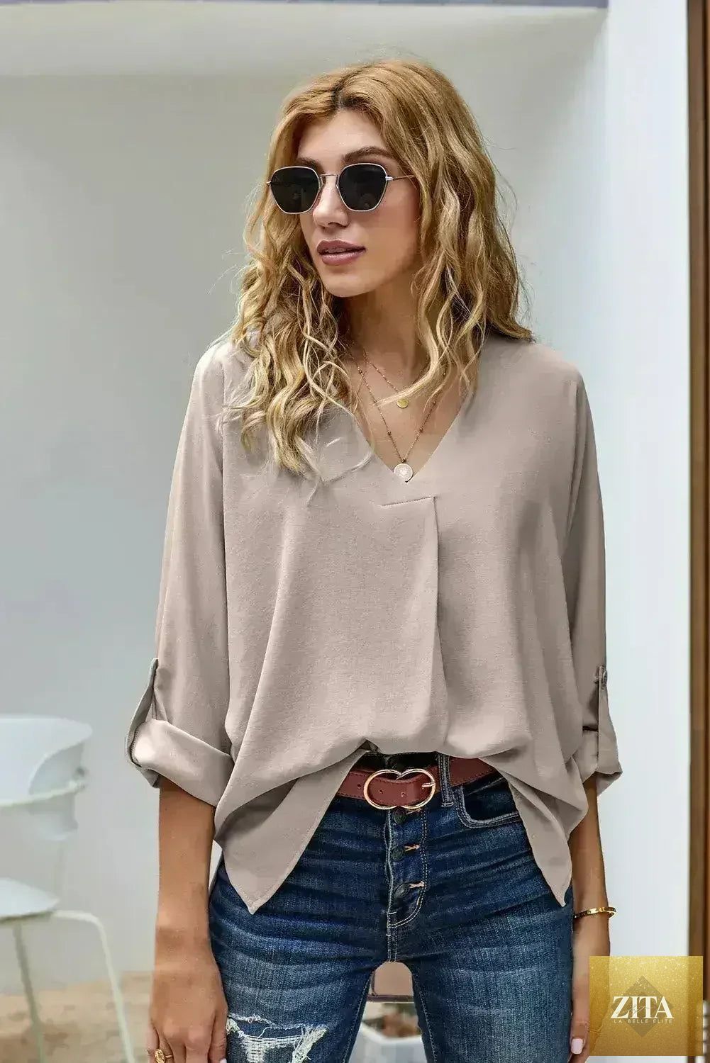 Femstylo elegant apricot V-neck blouse with 3/4 sleeves and high-low hem, perfect for stylish tops and blouses.