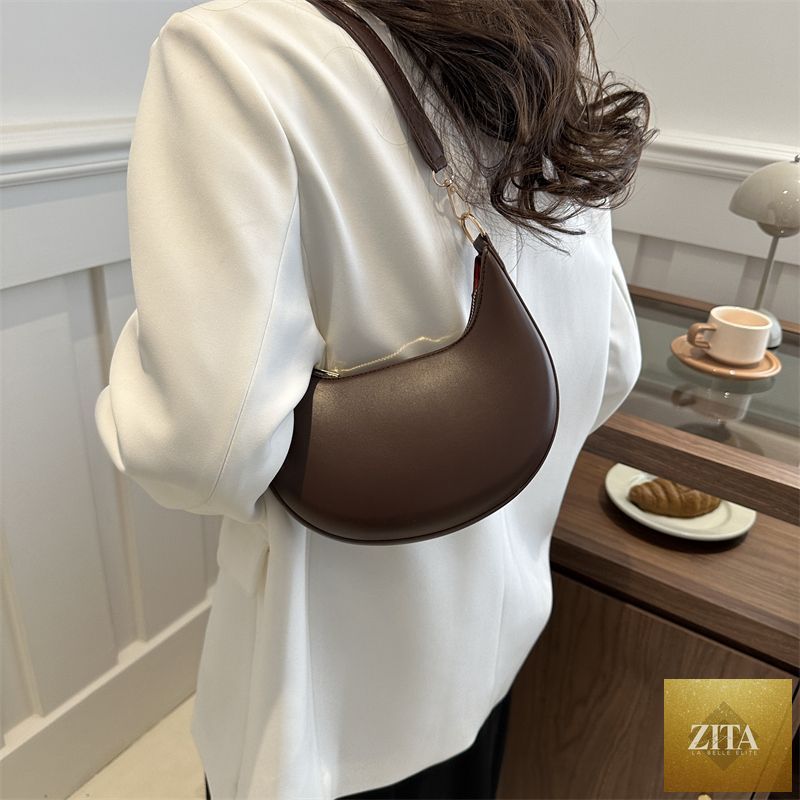 Social Buzz eSIMs Niche Crescent simple textured shoulder bag for women with minimalist design and neutral color, perfect for everyday use.