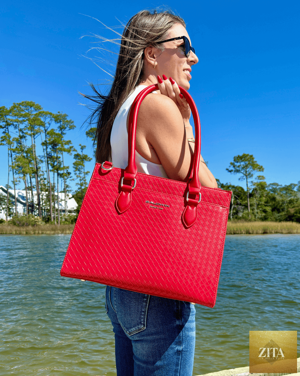 Baldwin Baby Company Montrose Diaper Bag Tote in cardinal red with multiple compartments and stylish design for parents on the go.