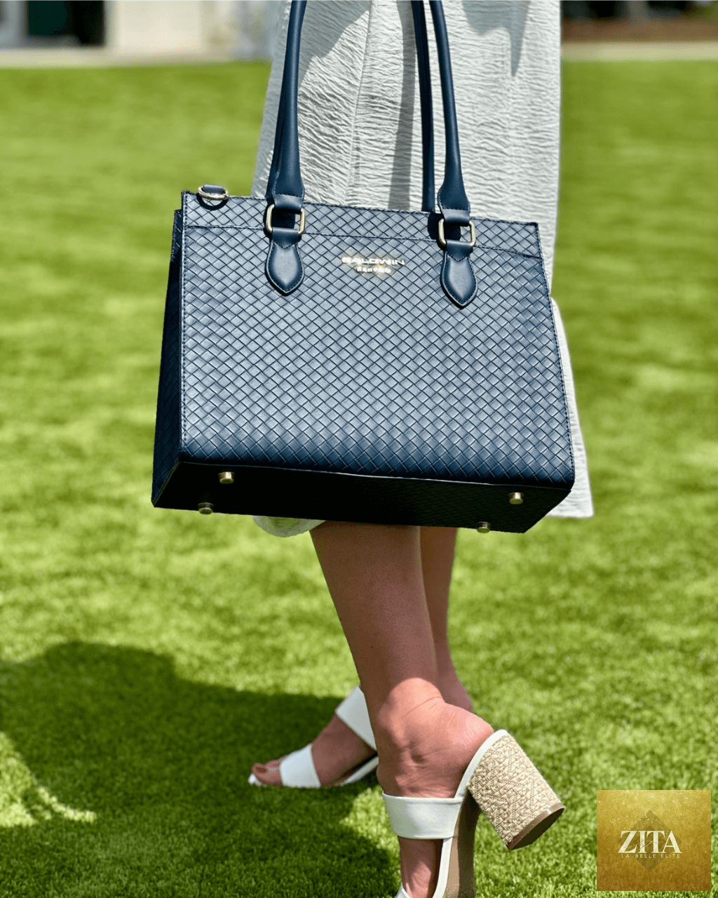 Cobalt diaper bag tote by Baldwin Baby Company featuring multiple compartments and stylish design for parents.