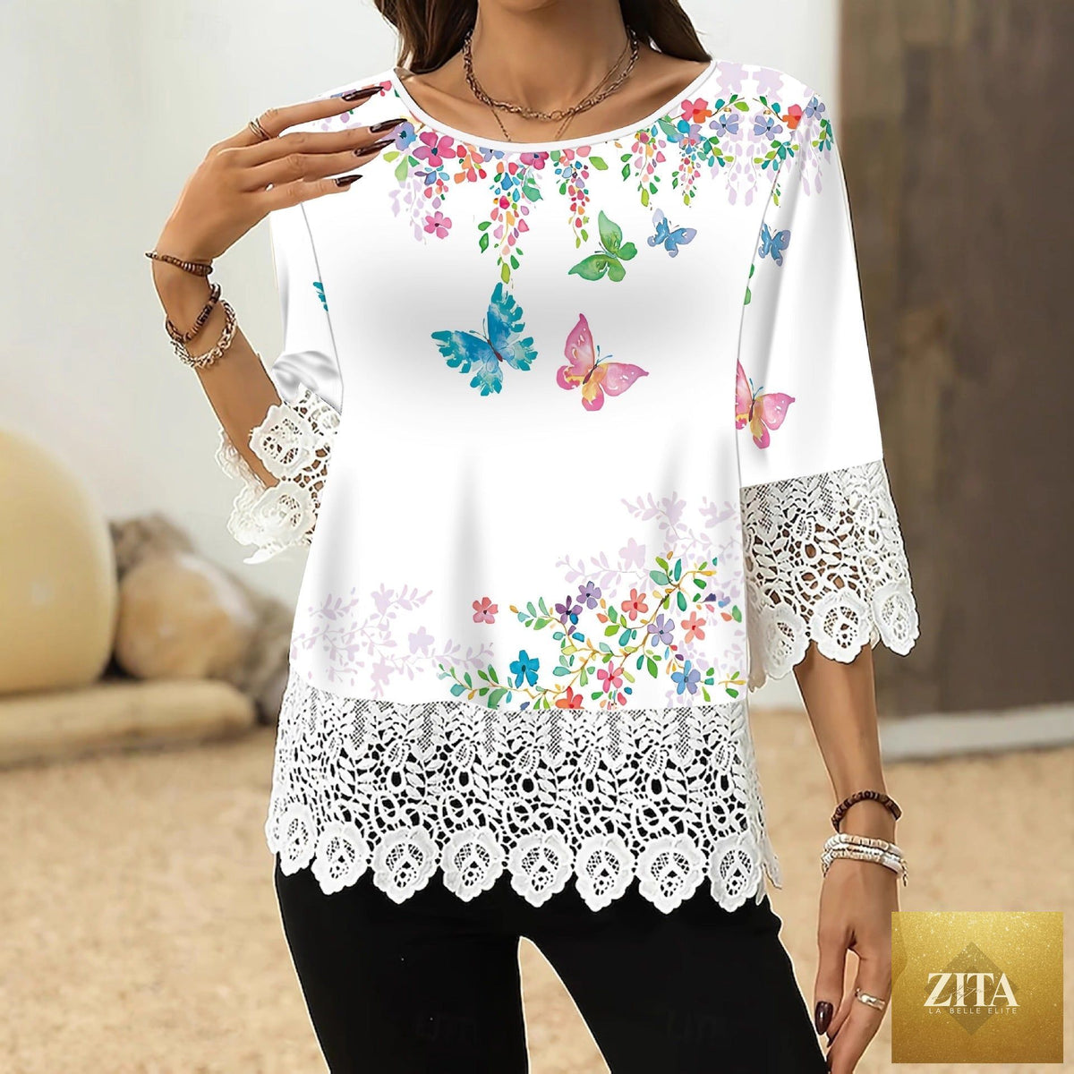 Women’s printed patchwork three-quarter sleeve casual top by Zita La Belle Elite, loose fit pullover with colorful patchwork design.