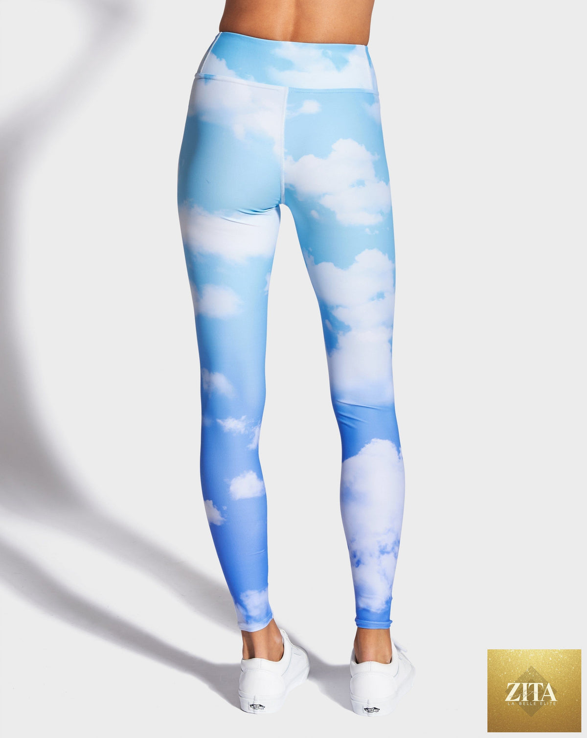Blue Skies yoga leggings by RUFFHAUS NYC, featuring a comfortable fit and vibrant blue color, shown on a model in a studio setting.