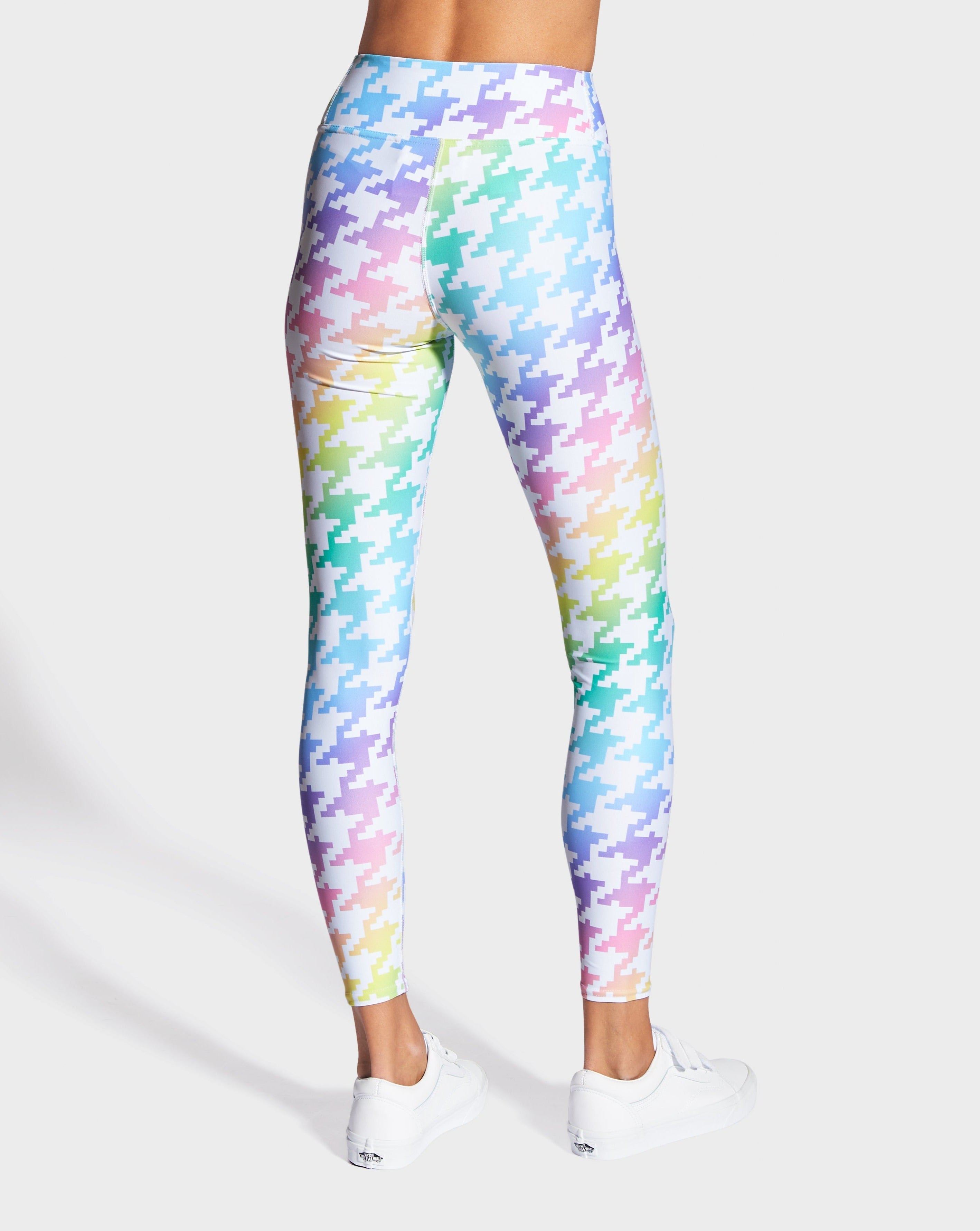 Rainbowtooth yoga leggings by RUFFHAUS NYC featuring vibrant rainbow patterns and a comfortable stretch fit for active wear.