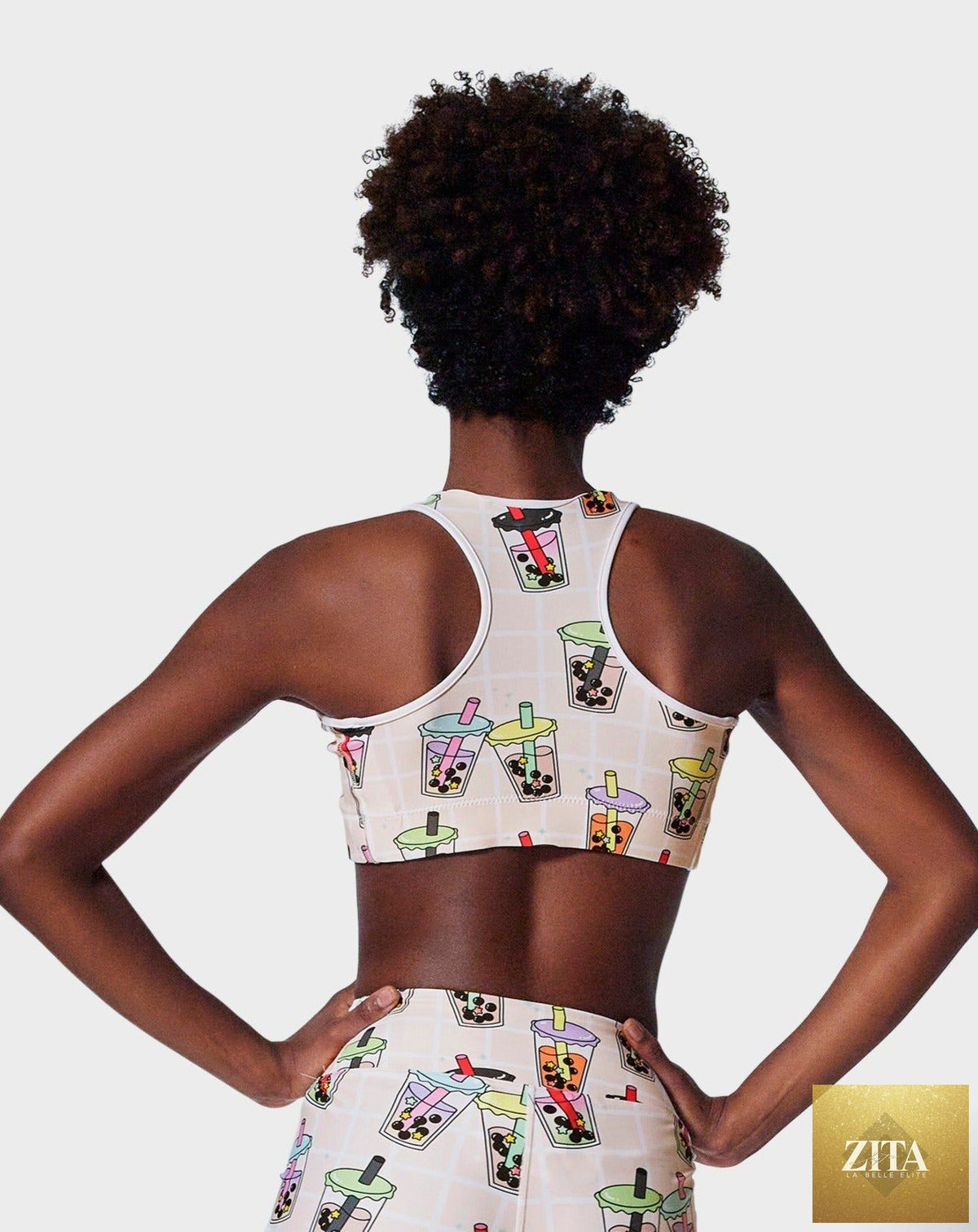 Ruffhaus NYC Boba Time sports bra with bold print, featuring supportive fabric and vibrant design on a mannequin.