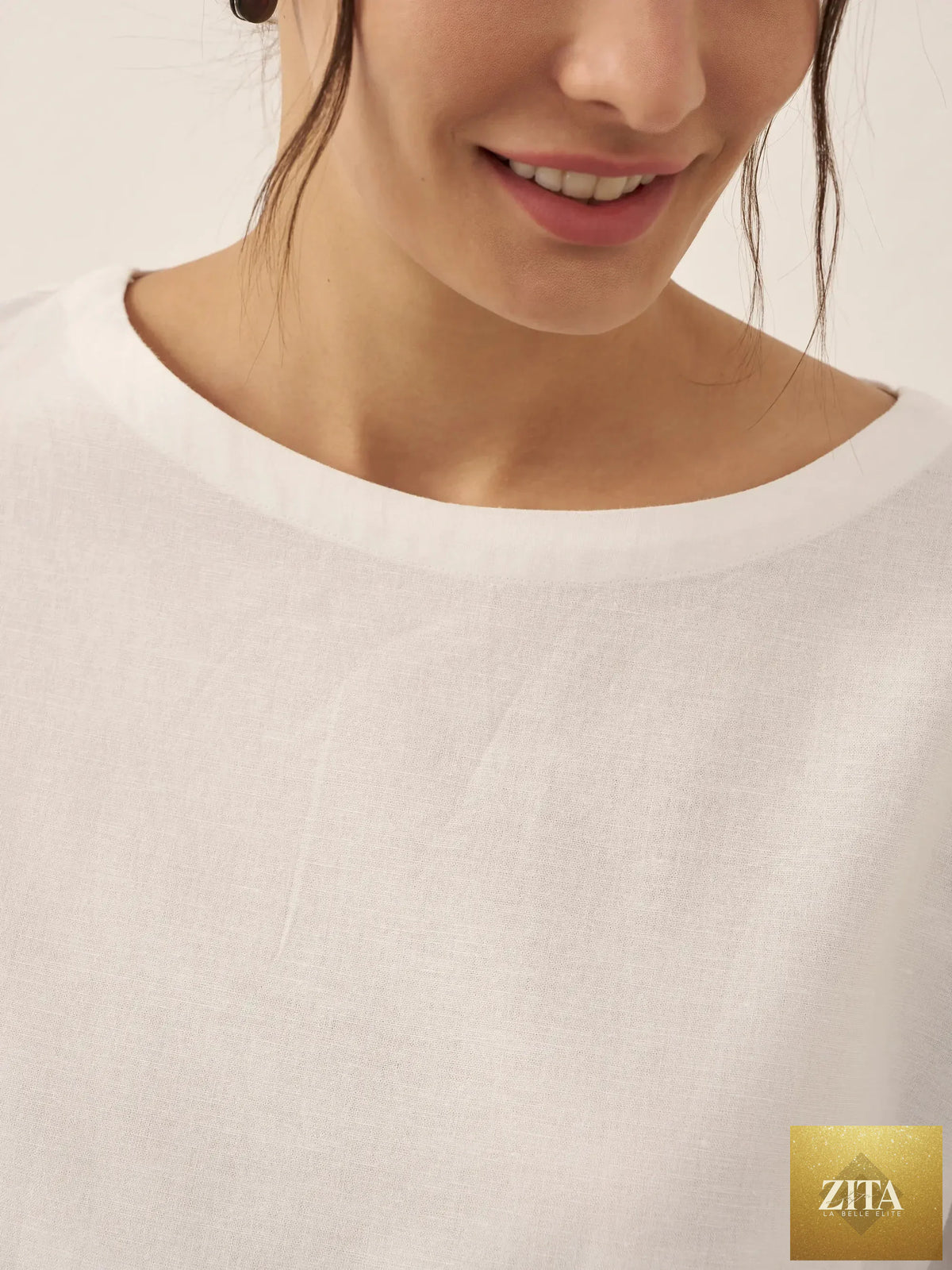 LINTICO Linen White Boat Neck Oversized Top, a relaxed blouse made of linen blend fabric, displayed on a neutral background.