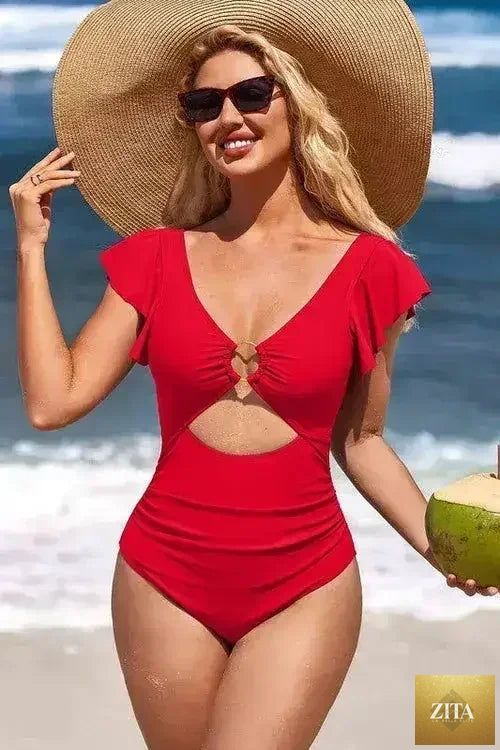Femstylo ruffle sleeve swimsuit with O-ring cutout and tummy control, featuring stylish design and vibrant swimwear fabric.