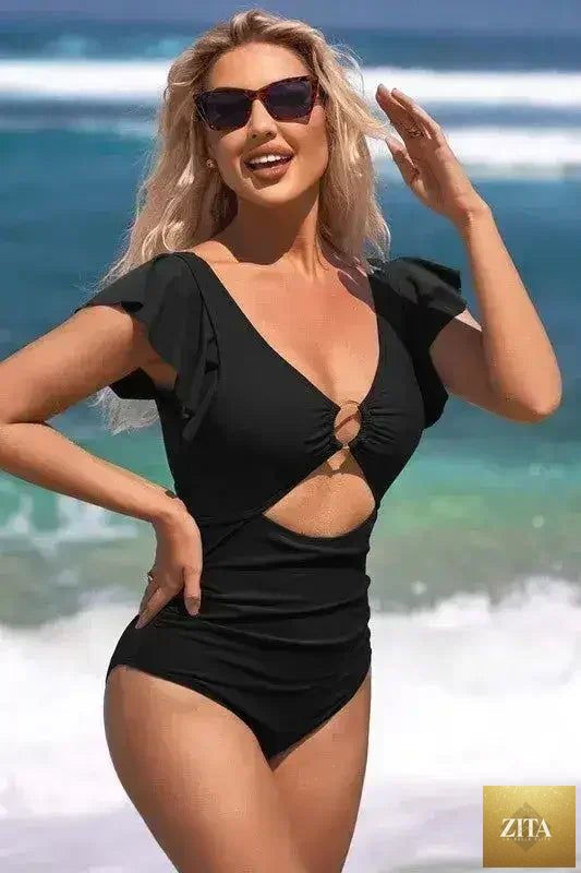Femstylo ruffle sleeve swimsuit with O-ring cutout and tummy control, featuring stylish design and vibrant color.